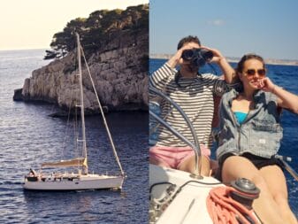 Un voilier et deux personnes qui regardent l'horizon